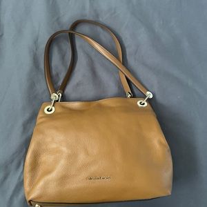Michael Kors “luggage” brown shoulder bag.
